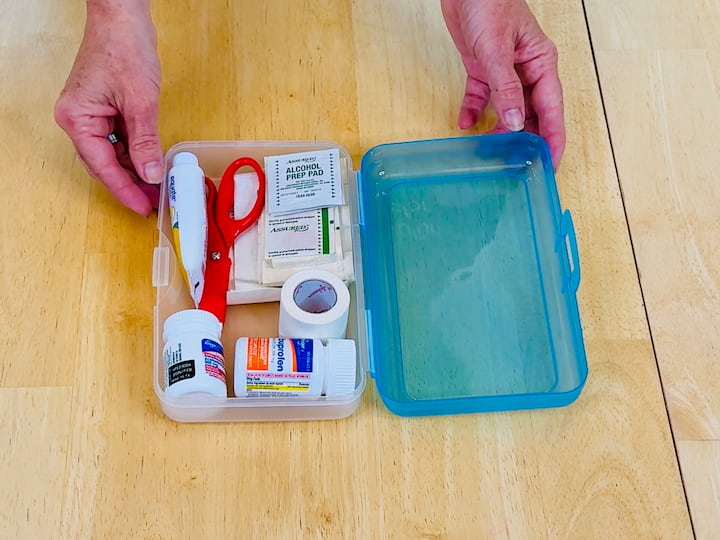 Compact First Aid Kit: I use a plastic school box filled with:
Band-aids
Alcohol wipes
Gauze and scissors
Ibuprofen or Tylenol
Neosporin