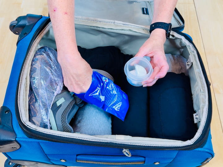 placing laundry pods into a small container