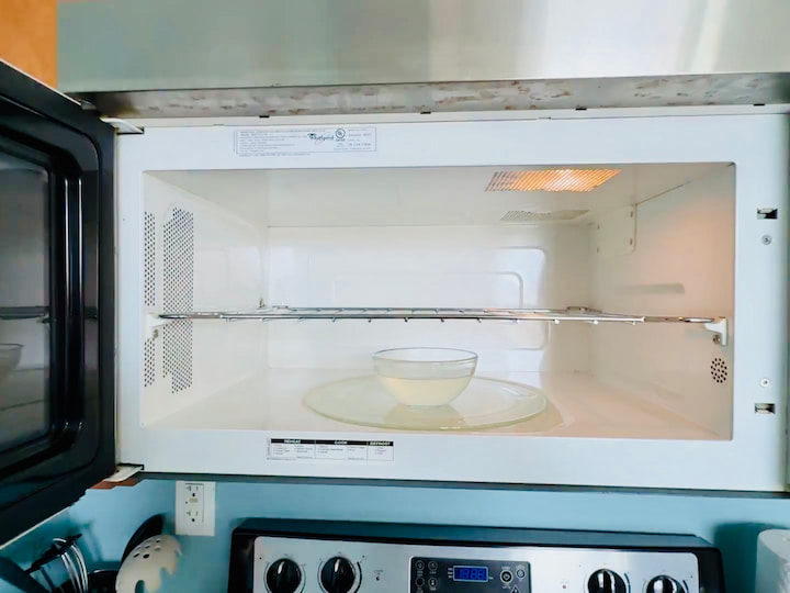 Microwave Steam Hack: Lime juice + vinegar + water microwaved for 5 minutes loosens up grime for easy wipe-down


