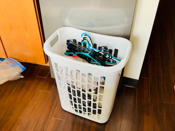 Laundry Basket: Used for pans, vacuum-sealed bags, and hangers to prevent tangling

