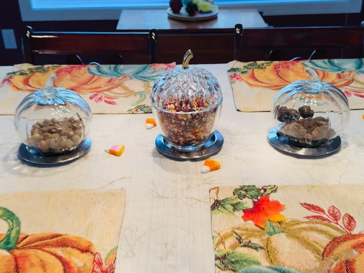 Thrift store pumpkin and acorn filled with acorns, walnuts, and indian corn