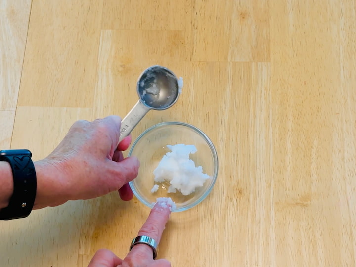 Adding coconut oil to bowl