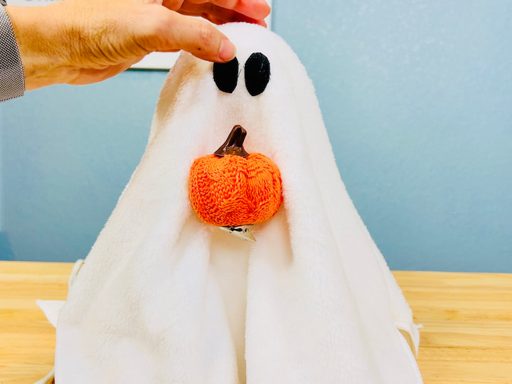 Cut and glue two black circles for eyes.