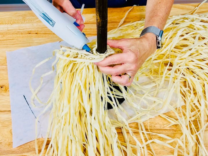 gluing hula skirt to the base of plunger