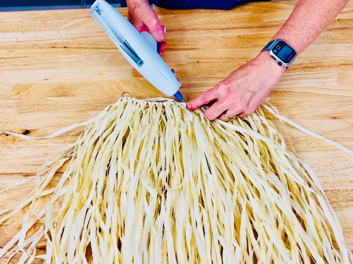 Gluing the hula skirt together