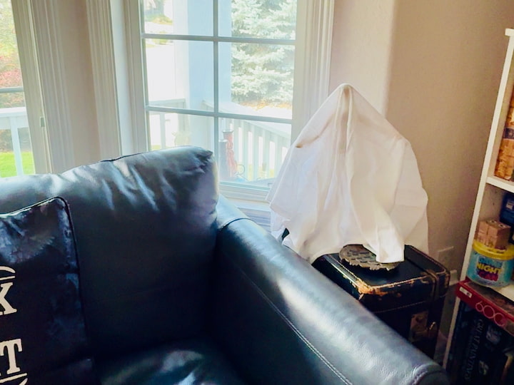 ikea doll covered with dish towel to create a ghost