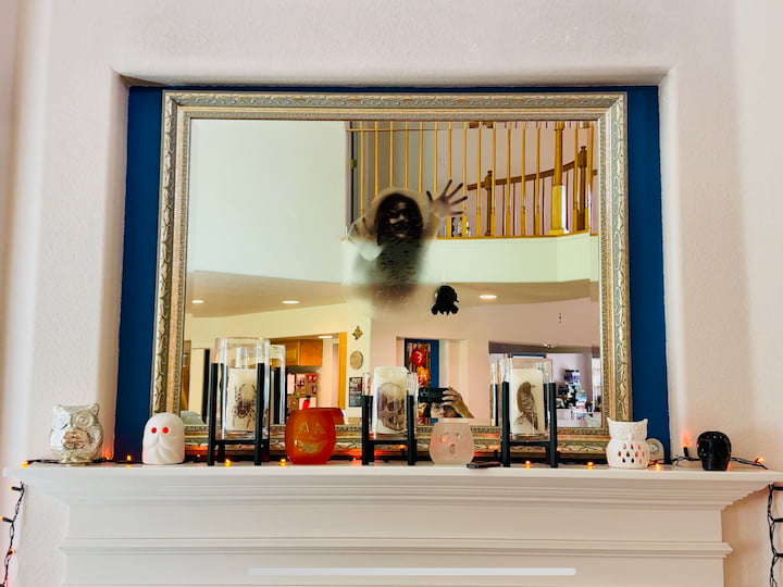 Window cling on mirror above mantel
