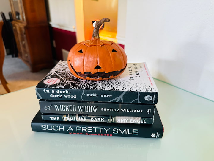 Book stack with pumpkin