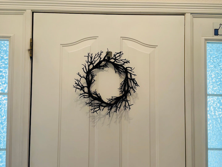halloween wreath hanging on door