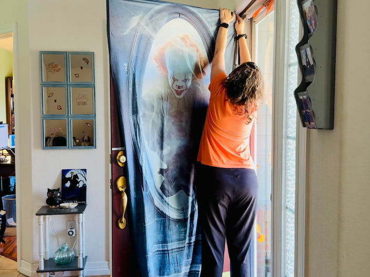 Chas putting door cover on front door