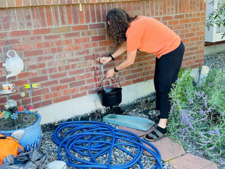 Chas filling cauldron up with water
