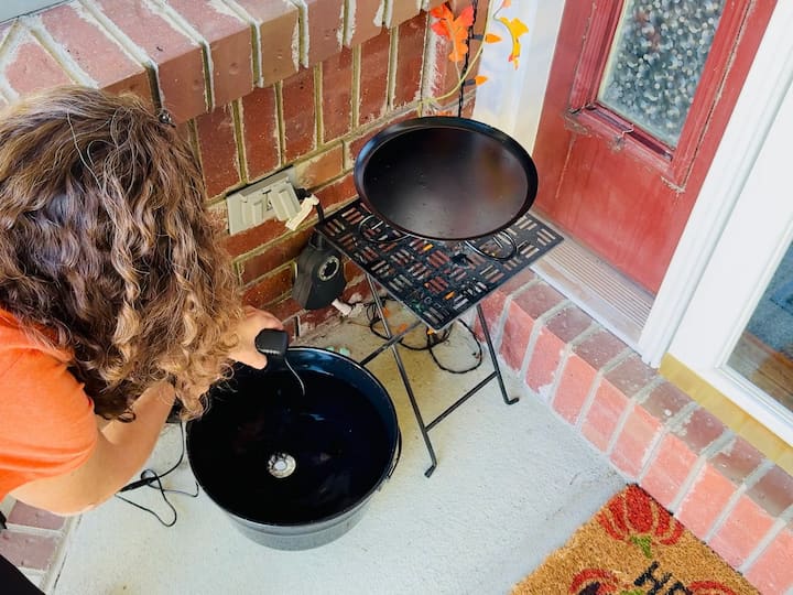 Placing cauldron on porch with color changing mister inside.