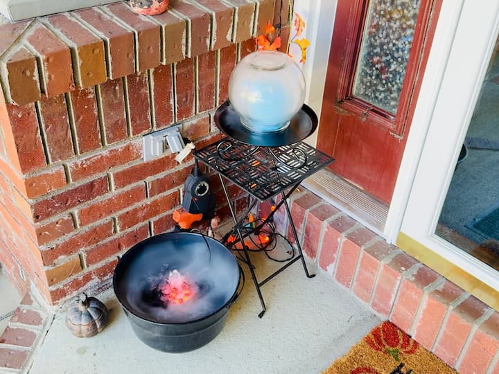 The cauldron and crystal ball together on the porch