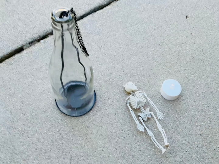 bottle candle holder and skeleton