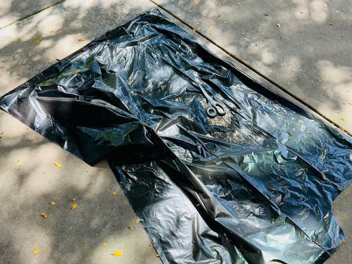 Trash bag and scissors