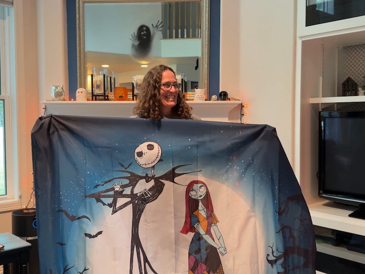 Chas holding shower curtain