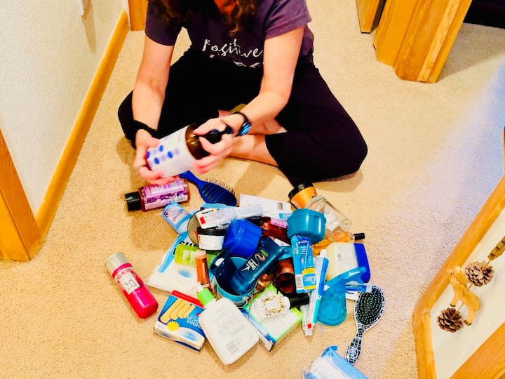 Chas sorting bathroom supplies