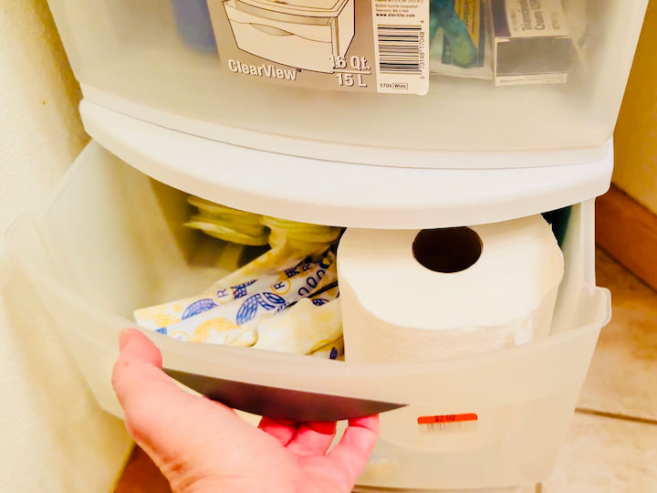 Drawer with toilet paper and supplies