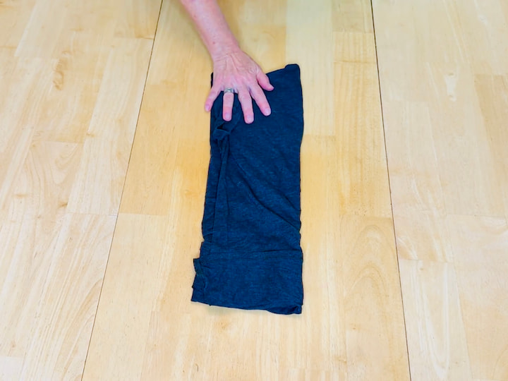 fold both sides in for the military roll