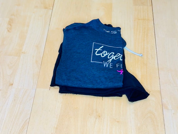 Place the folded shirt on top of the other clothes to make a clothes sandwich for packing