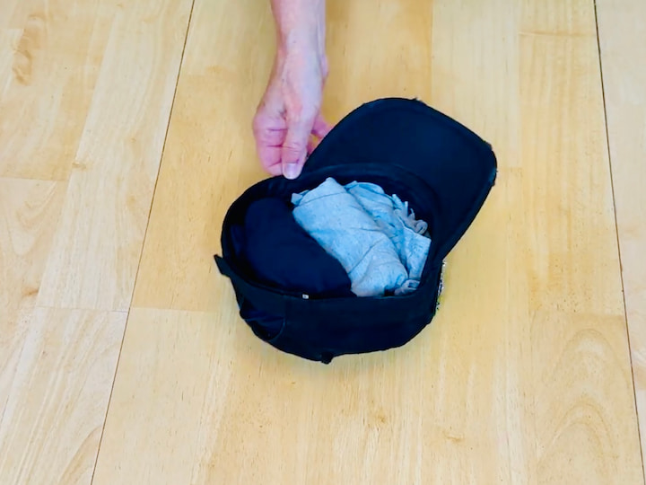 Stuff your hat with pajamas or rolled clothing to hold its shape and save space.