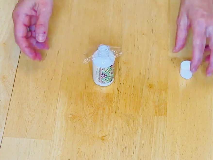 Place cling wrap or tape under bottle caps before closing