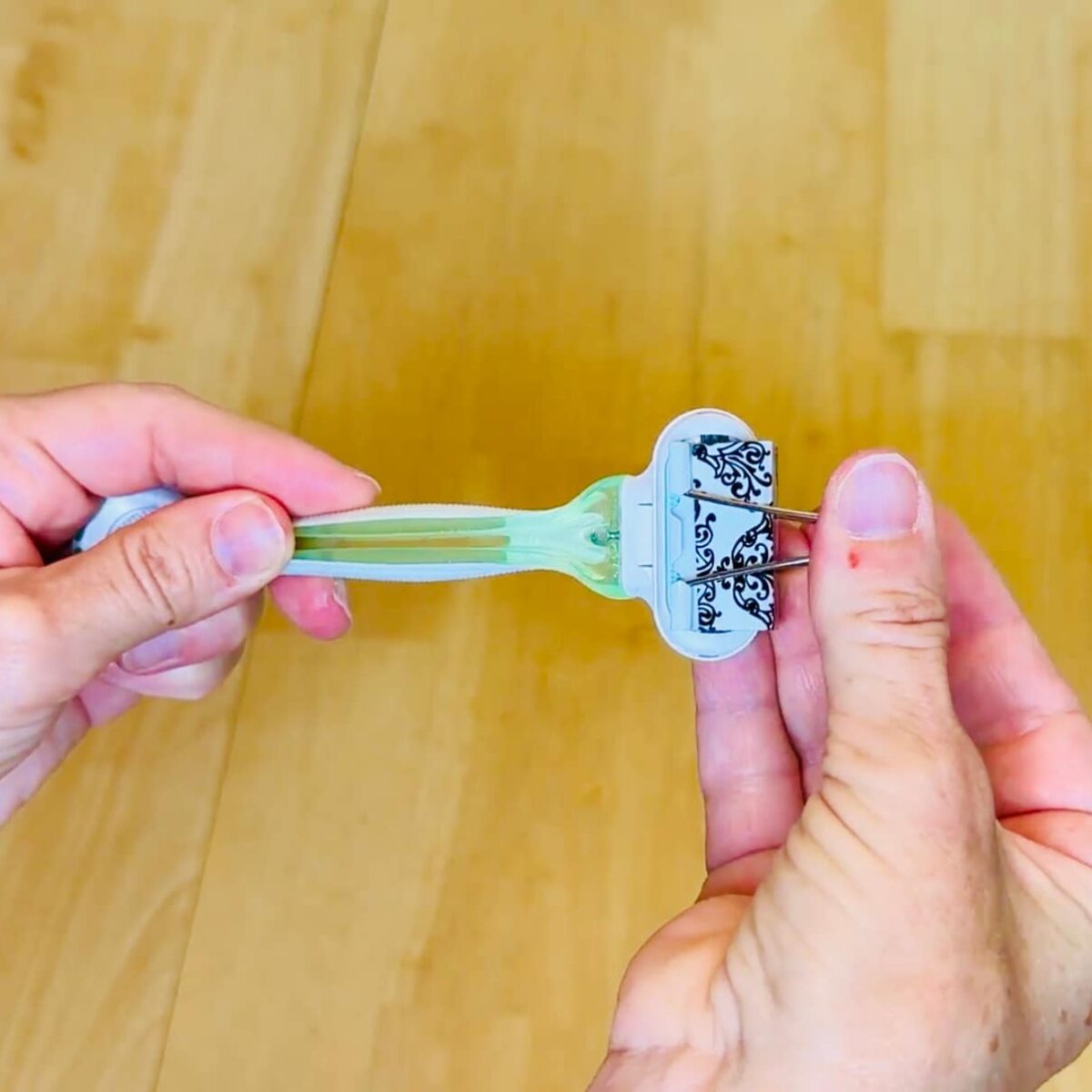 Protect razor blades with a binder clip to avoid damage