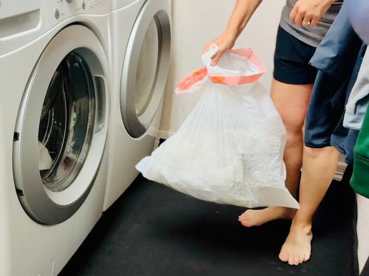 Using garbage bag to hold laundry