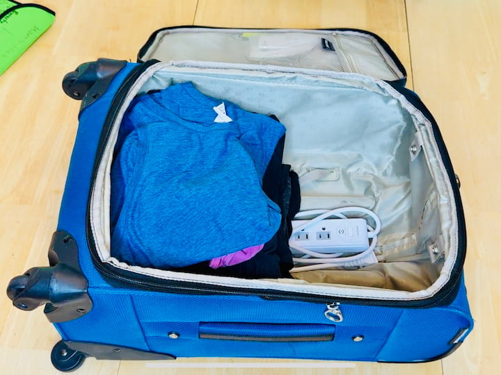 Wipes, chargers, and accessories tucked around edges for stability.