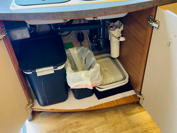 Under-Sink Garbage: I placed the main garbage can under the sink, and a smaller Dollar Tree can next to it for recyclables.