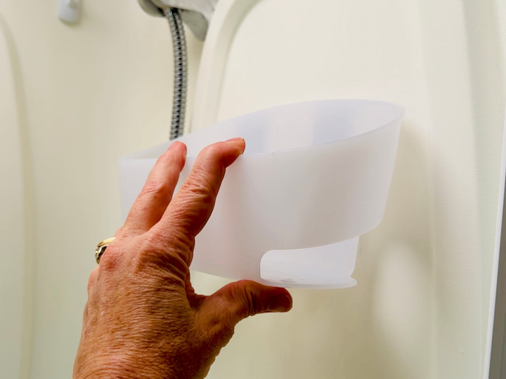 Command Centers: Using Command Strips and Caddies is essential for adding shampoo, conditioner, and soap without drilling.