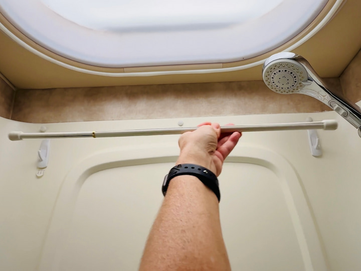 or use a tension rod stretched between the hooks to create a towel rack.